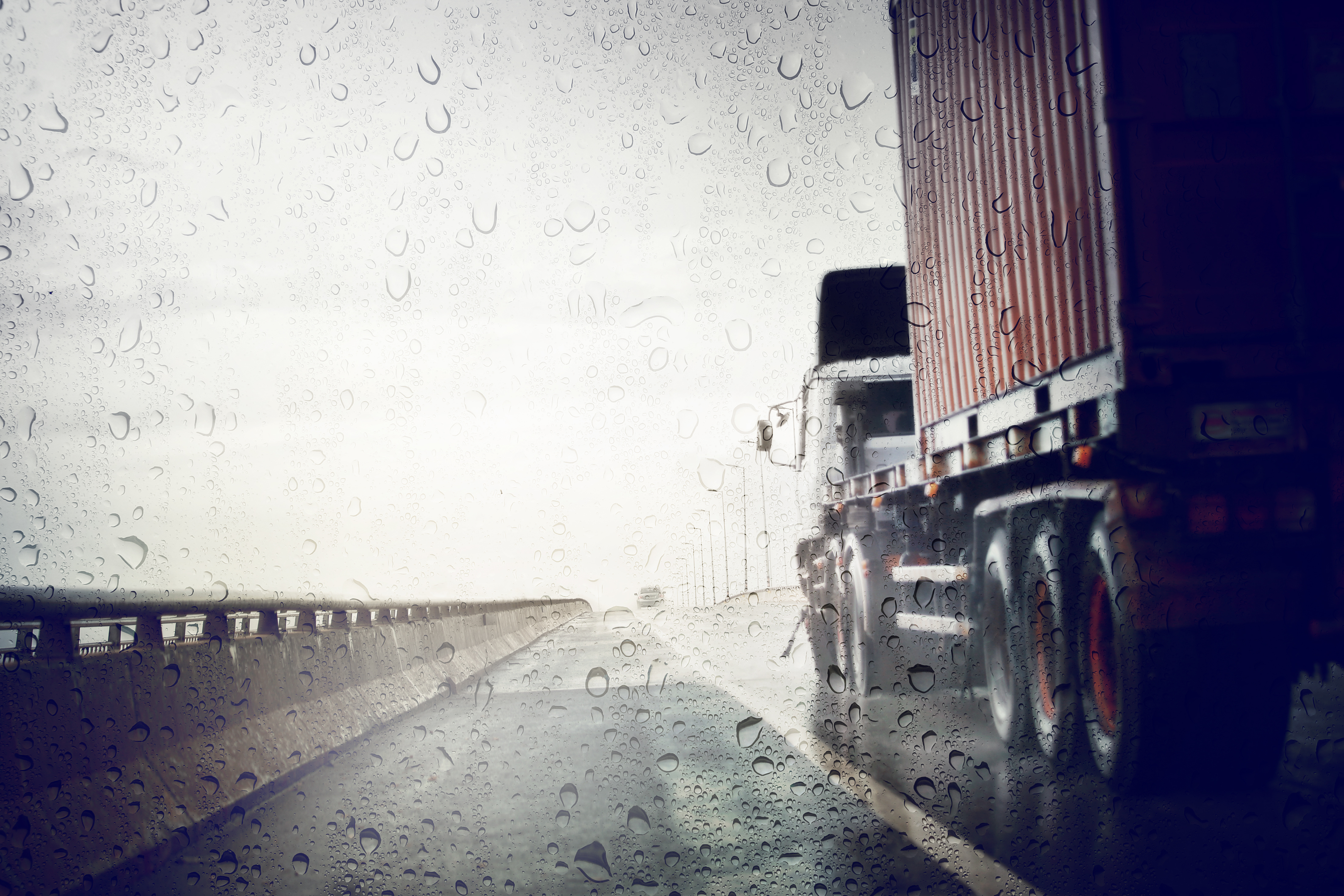 Semi-truck in the rain on highway